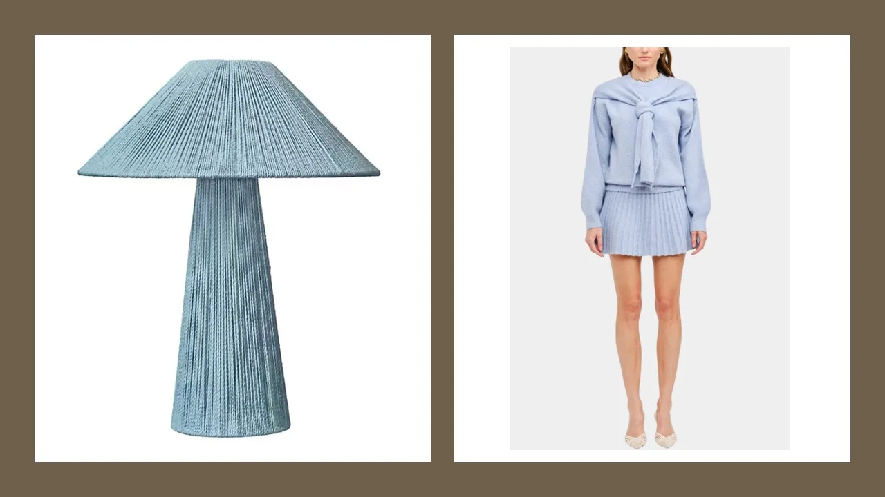 A pleated blue table lamp beside a pleated skirt and sweater